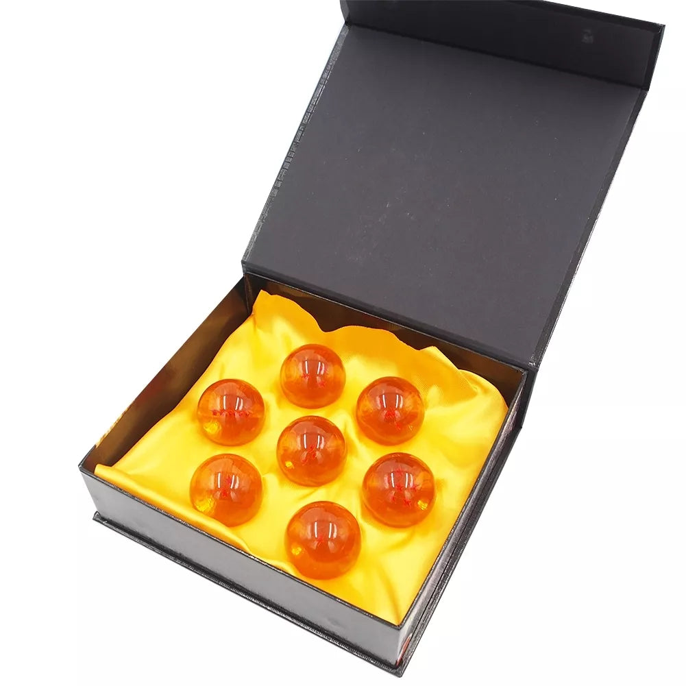 Anime Dragon Ball drakono rutulių rinkinys su dėžute, septyni spalvoti rutuliai su simboliais ir paveikslėliais.
