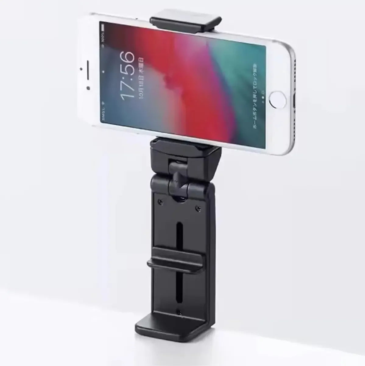 Universalus telefono laikiklis su segtuku, tvirtai laikantis išmanųjį telefoną ir patogiai montuojamas bet kurioje vietoje.