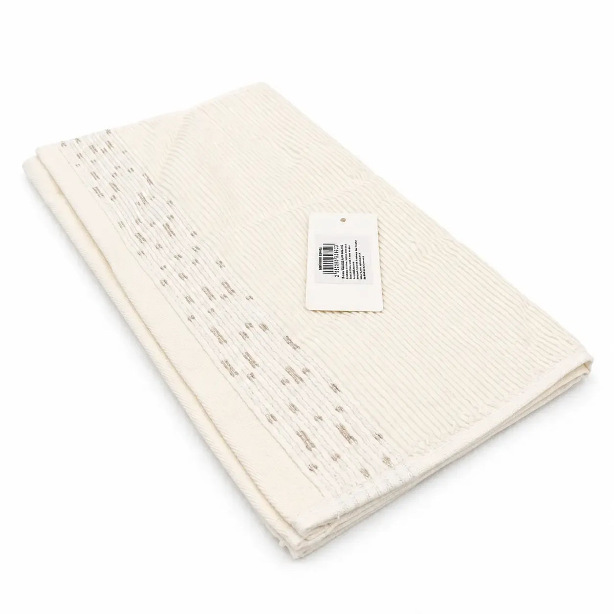 Kreminės spalvos medvilninis rankšluostis, matmenys 34 × 74 cm, švarus ir minkštas, puikiai tinka kasdieniam naudojimui.