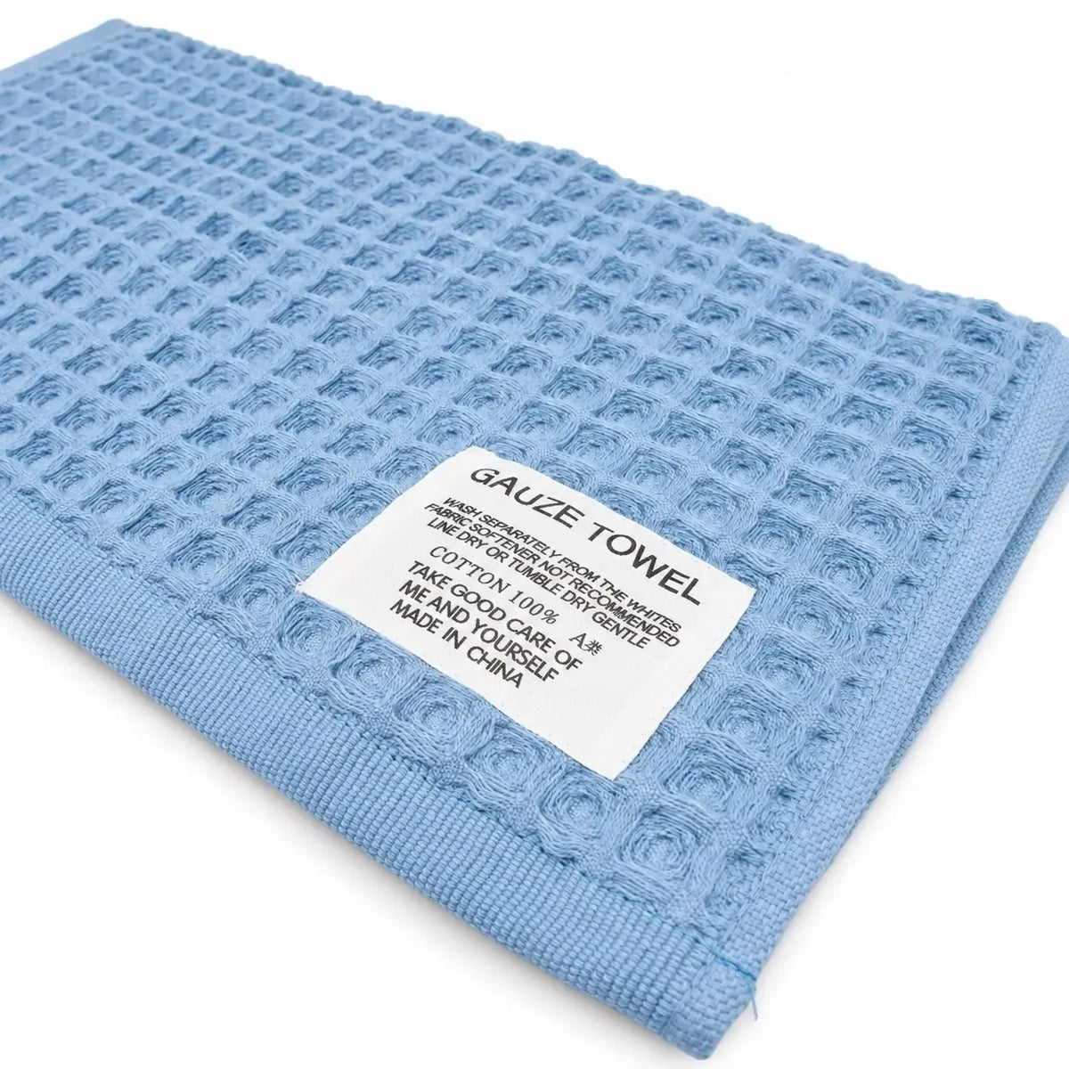 Žydros spalvos medvilninis koriuko tipo rankšluostis, matmenys 34 × 74 cm, rankų džiovinimui ir kasdieniam naudojimui.