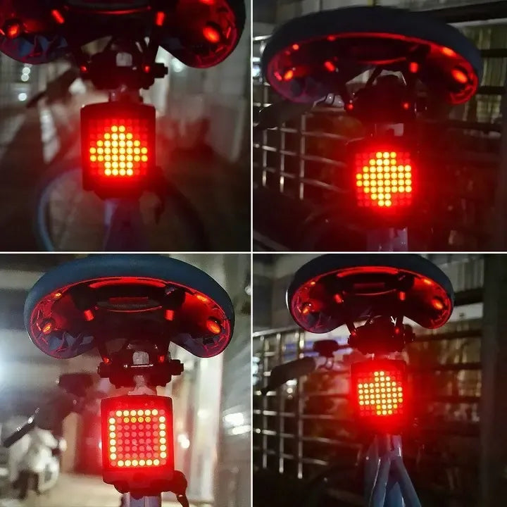 Dviračio LED žibintas su posūkių signalais ir lazeriniu atšvaitu, matomas iš priekio, tvirtinamas prie dviračio rankenos.