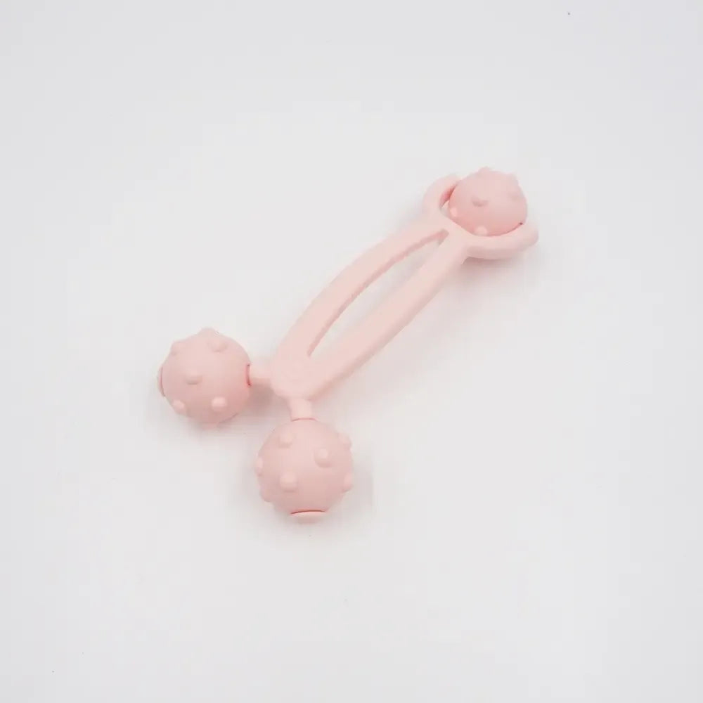 Plastikinis kūno masažuoklis TR782A, naudojamas odos masažui ir atsipalaidavimui, su ergonominiu dizainu.